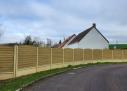 Dolleans Service installe une clôture Mur Plaque imitation Bois à Gasny dans le 27